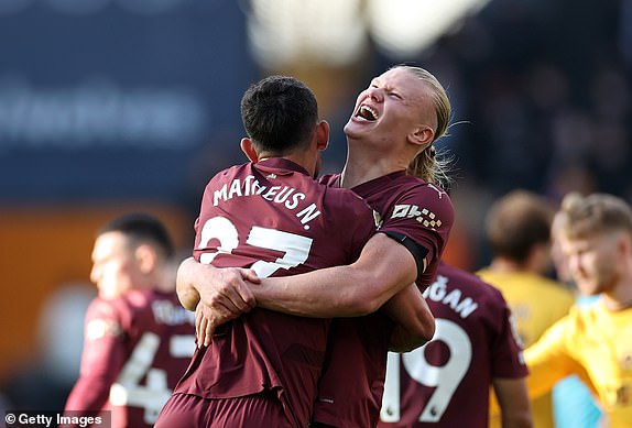 WOLVERHAMPTON, ENGLAND - OCTOBER 20: Matheus Nunes and Erling Haaland of Manchester City celebrate after the team's victory during the Premier League match between Wolverhampton Wanderers FC and Manchester City FC at Molineux on October 20, 2024 in Wolverhampton, England. (Photo by Ryan Pierse/Getty Images)