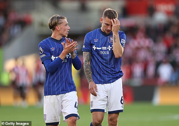 BRENTFORD, ENGLAND - OCTOBER 26: Luke Woolfenden and Jack Clarke of Ipswich Town leave the pitch at the end of the Premier League match between Brentford FC and Ipswich Town FC at Gtech Community Stadium on October 26, 2024 in Brentford, England. (Photo by Ryan Pierse/Getty Images)