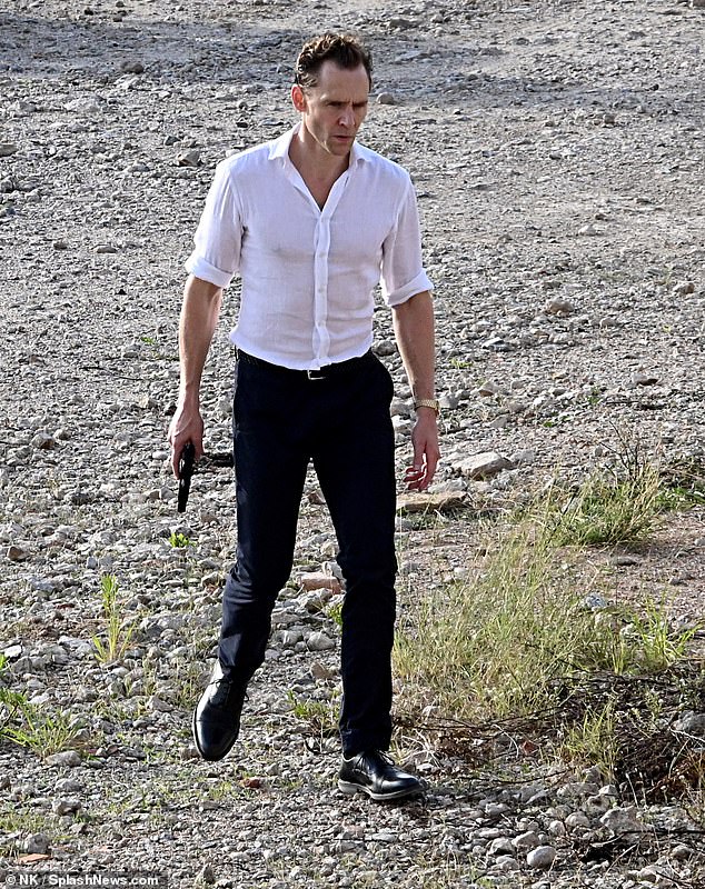 Tom Hiddleston channel his inner James Bond as he appears on set of The Night Manager