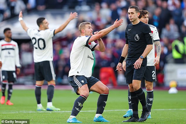 Man United's Dutch defender Matthijs de Ligt (middle) was deemed to have made a foul in the box