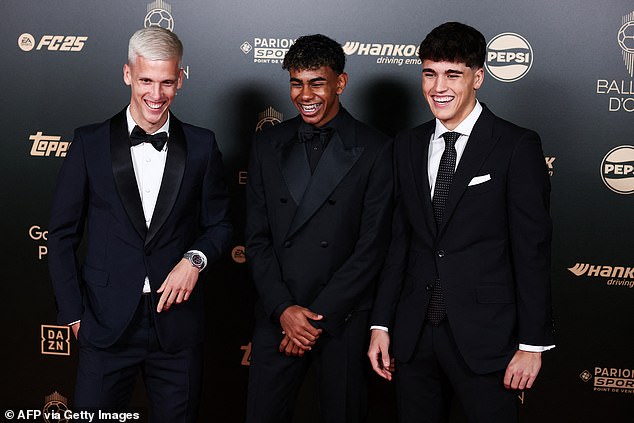 Yamal laughs alongside fellow Barca stars Dani Olmo (left) and Pau Cubarsi (right)