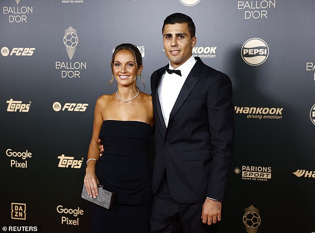 Rodri arrived for the Ballon d'Or ceremony on crutches but was spared them for this photograph with his girlfriend Laura Iglesias