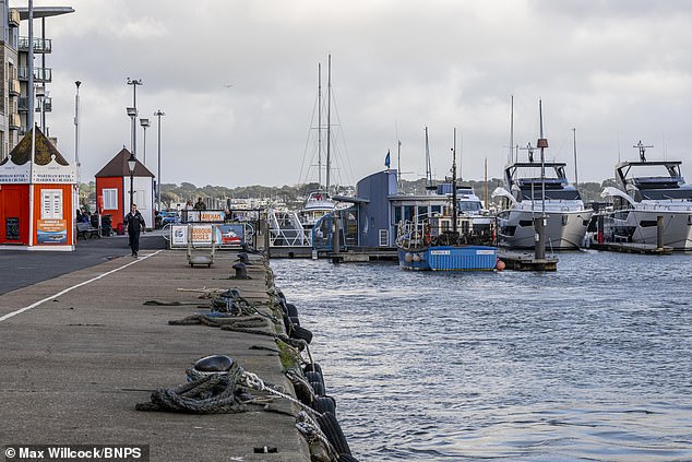 Murdo Macleod Mackenzie, 74, drowned after strapping himself into his motorised wheelchair and driving off a harbour wall at Poole Quay in Dorset, an inquest heard