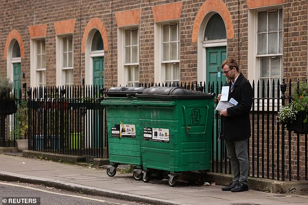 An Anti-abortion campaigner stands on Whitfields Street near the Marie Stopes International (MSI) Reproductive Choices treatment centre in London today