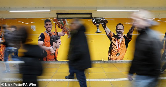 Wolverhampton Wanderers fans make their way to the stadium before the Premier League match at Molineux, Wolverhampton. Picture date: Saturday November 2, 2024. PA Photo. See PA story SOCCER Wolves. Photo credit should read: Nick Potts/PA Wire.RESTRICTIONS: EDITORIAL USE ONLY No use with unauthorised audio, video, data, fixture lists, club/league logos or "live" services. Online in-match use limited to 120 images, no video emulation. No use in betting, games or single club/league/player publications.