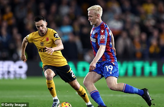 WOLVERHAMPTON, ENGLAND - NOVEMBER 02: Will Hughes of Crystal Palace runs with the ball whilst under pressure from Pablo Sarabia of Wolverhampton Wanderers during the Premier League match between Wolverhampton Wanderers FC and Crystal Palace FC at Molineux on November 02, 2024 in Wolverhampton, England. (Photo by Naomi Baker/Getty Images)