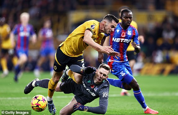 WOLVERHAMPTON, ENGLAND - NOVEMBER 02: Pablo Sarabia of Wolverhampton Wanderers is challenged by Dean Henderson of Crystal Palace in the penalty area during the Premier League match between Wolverhampton Wanderers FC and Crystal Palace FC at Molineux on November 02, 2024 in Wolverhampton, England. (Photo by Naomi Baker/Getty Images)