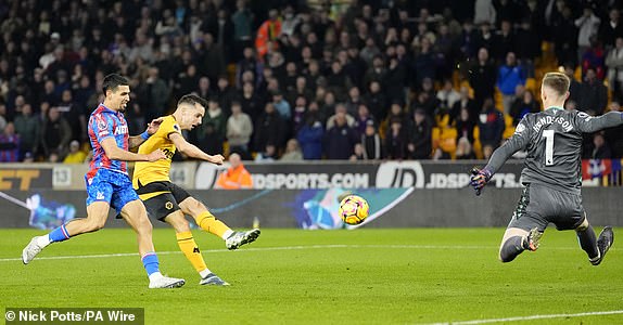 Wolverhampton Wanderers' Pablo Sarabia (centre) has his shot saved by Crystal Palace's Dean Henderson (right) during the Premier League match at Molineux, Wolverhampton. Picture date: Saturday November 2, 2024. PA Photo. See PA story SOCCER Wolves. Photo credit should read: Nick Potts/PA Wire.RESTRICTIONS: EDITORIAL USE ONLY No use with unauthorised audio, video, data, fixture lists, club/league logos or "live" services. Online in-match use limited to 120 images, no video emulation. No use in betting, games or single club/league/player publications.