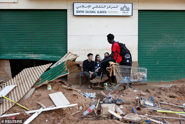 Debris can be seen throughout the town following the flooding