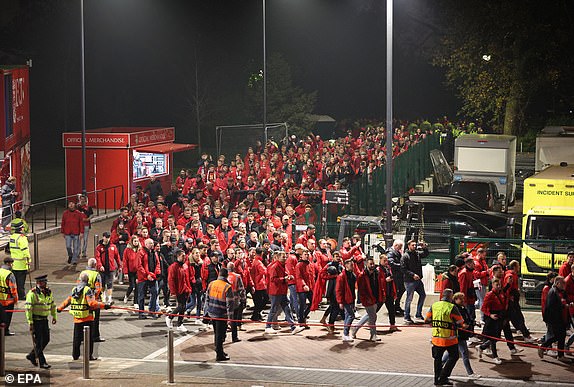 epa11703374 Leverkusen fans arrive at Anfield stadium ahead of the UEFA Champions League league phase match between Liverpool FC and Bayer 04 Leverkusen, in Liverpool, Britain, 05 November 2024.  EPA/ADAM VAUGHAN