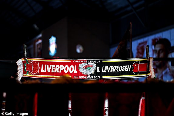 LIVERPOOL, ENGLAND - NOVEMBER 5: A half and half Liverpool v BAYER LEVERKUSEN scarf sold at a merchandise stall ahead of the UEFA Champions League 2024/25 League Phase MD4 match between Liverpool FC and Bayer 04 Leverkusen at Anfield on November 5, 2024 in Liverpool, England. (Photo by Robbie Jay Barratt - AMA/Getty Images)