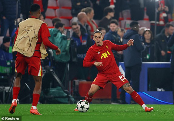 Soccer Football - Champions League - Liverpool v Bayer Leverkusen - Anfield, Liverpool, Britain - November 5, 2024 Liverpool's Kostas Tsimikas during the warm up before the match REUTERS/Molly Darlington