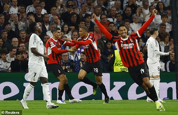 Soccer Football - Champions League - Real Madrid v AC Milan - Santiago Bernabeu, Madrid, Spain - November 5, 2024 AC Milan's Malick Thiaw celebrates scoring their first goal with Alvaro Morata REUTERS/Susana Vera