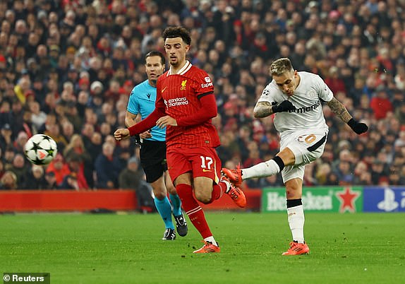 Soccer Football - Champions League - Liverpool v Bayer Leverkusen - Anfield, Liverpool, Britain - November 5, 2024 Bayer Leverkusen's Alex Grimaldo shoots at goal REUTERS/Molly Darlington