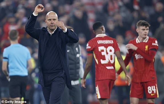 LIVERPOOL, ENGLAND - NOVEMBER 5: Arne Slot, Manager of Liverpool celebrates after winning the UEFA Champions League 2024/25 League Phase MD4 match between Liverpool FC and Bayer 04 Leverkusen at Anfield on November 5, 2024 in Liverpool, England. (Photo by Richard Sellers/Sportsphoto/Allstar via Getty Images)