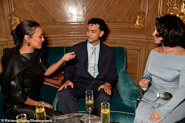 Maya, Archie Madekwe and Raye enjoyed a glass of bubbly in a booth during the ceremony