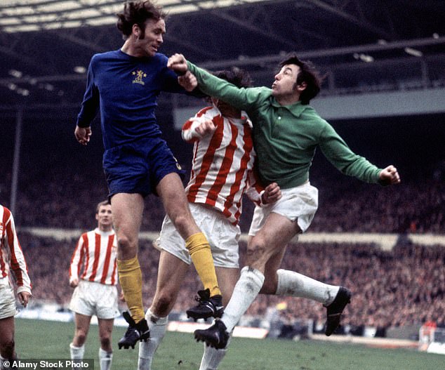 Former Chelsea and Republic of Ireland defender John Dempsey has died aged 78 (pictured: going up for a header against Stoke and England's Gordon Banks)