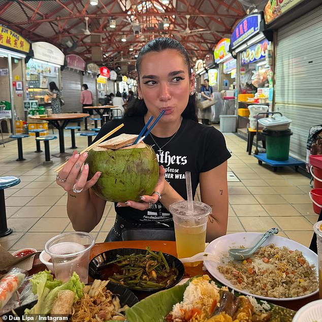 The singer, 29, who is currently on the beginning trail of her Radical Optimism tour in Asia, sampled some local cuisine as she went for a meal with her team