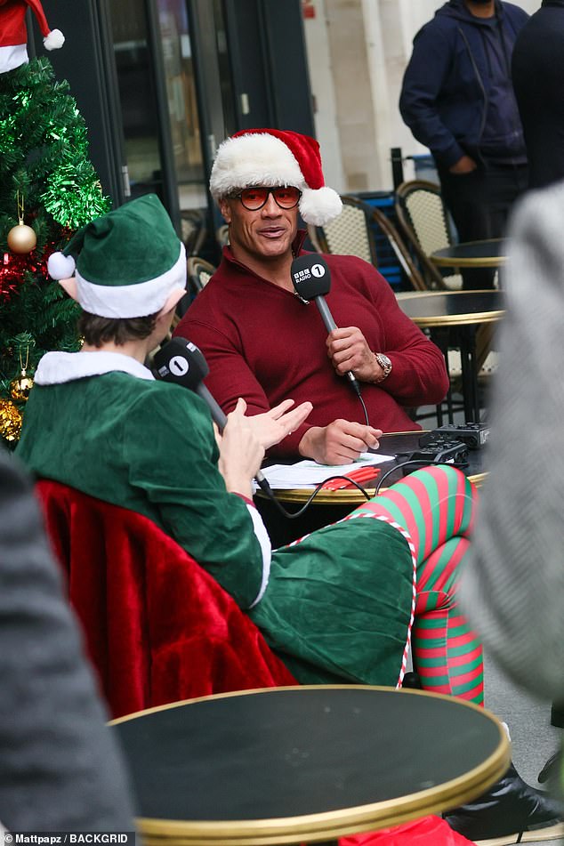 Kiernan was joined by her co-star Dwayne who got into the Christmas spirit by sporting a Santa hat as he was interviewed by BBC Radio 1 presenter Greg James