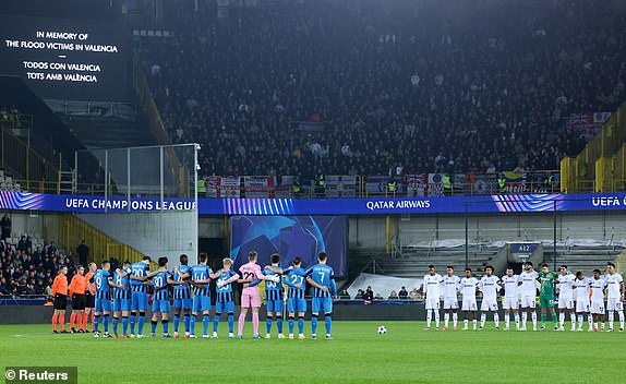 Soccer Football - Champions League - Club Brugge v Aston Villa - Jan Breydel Stadium, Bruges, Belgium - November 6, 2024 The players stand during a minutes silence in memory of the flood victims in Valencia before the match REUTERS/Yves Herman