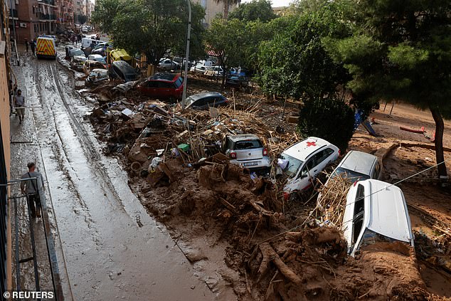 Damaged cars and debris are pictured at the side of a road, following heavy rains that caused floods, in Paiporta, near Valencia, Spain, November 6, 2024