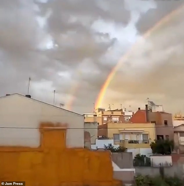 Pictured above are the twin rainbows spotted over Barcelona just days before the devastating floods hit the area more than a week ago