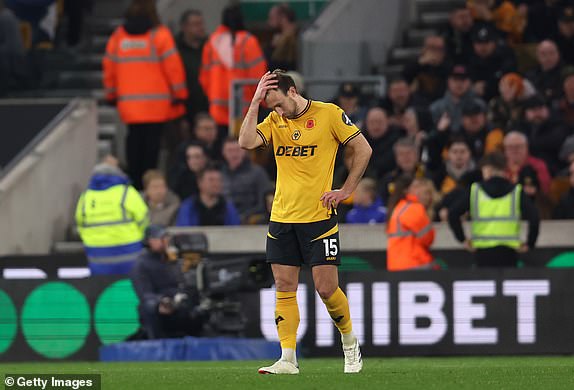 WOLVERHAMPTON, ENGLAND - NOVEMBER 02: Craig Dawson of Wolverhampton Wanderers shows dejection after Trevoh Chalobah of Crystal Palace (not pictured) scores his team's first goal during the Premier League match between Wolverhampton Wanderers FC and Crystal Palace FC at Molineux on November 02, 2024 in Wolverhampton, England. (Photo by Nathan Stirk/Getty Images)