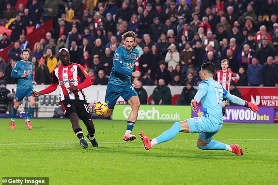 BRENTFORD, ENGLAND - NOVEMBER 09: Yoane Wissa of Brentford scores his team's third goal past Kepa Arrizabalaga of AFC Bournemouth during the Premier League match between Brentford FC and AFC Bournemouth at Gtech Community Stadium on November 09, 2024 in Brentford, England. (Photo by Marc Atkins/Getty Images)