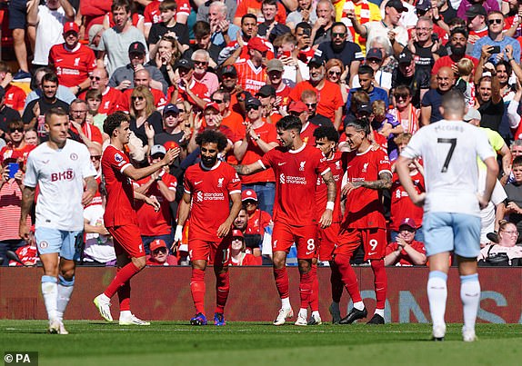 Liverpool players celebrate their side's second goal of the game, an own goal scored by Aston Villa's Matty Cash, during the Premier League match at Anfield, Liverpool. Picture date: Sunday September 3, 2023. PA Photo. See PA story SOCCER Liverpool. Photo credit should read: Peter Byrne/PA Wire.RESTRICTIONS: EDITORIAL USE ONLY No use with unauthorised audio, video, data, fixture lists, club/league logos or "live" services. Online in-match use limited to 120 images, no video emulation. No use in betting, games or single club/league/player publications.