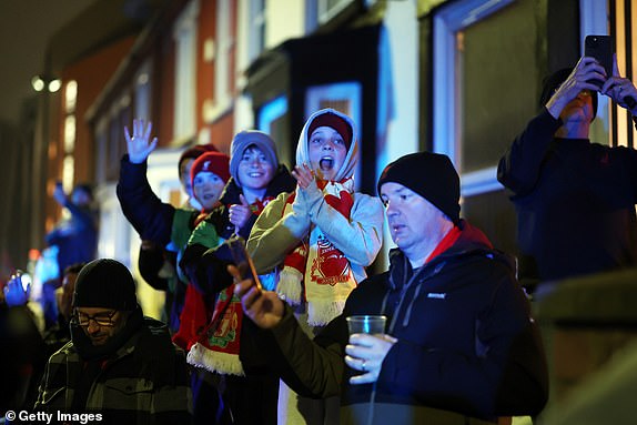 LIVERPOOL, ENGLAND - NOVEMBER 09: Fans of Liverpool react outside the stadium prior to the Premier League match between Liverpool FC and Aston Villa FC at Anfield on November 09, 2024 in Liverpool, England. (Photo by Carl Recine/Getty Images)