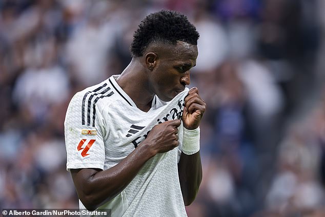 Vinicius pictured kissing the Madrid badge on his shirt during Saturday's game in LaLiga