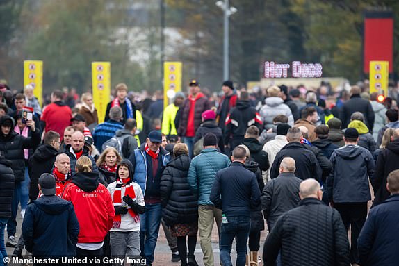 MANCHESTER, ENGLAND - NOVEMBER 10: Manchester United fans arrive ahead of the Premier League match between Manchester United FC and Leicester City FC at Old Trafford on November 10, 2024 in Manchester, England. (Photo by Ash Donelon/Manchester United via Getty Images)