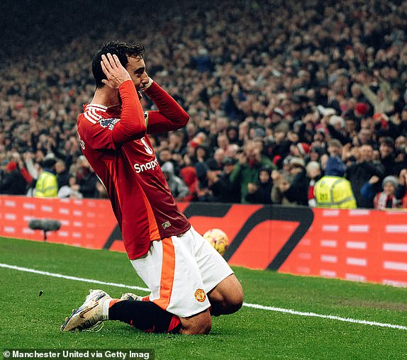 MANCHESTER, ENGLAND - NOVEMBER 10: Bruno Fernandes of Manchester United celebrates scoring their first goal during the Premier League match between Manchester United FC and Leicester City FC at Old Trafford on November 10, 2024 in Manchester, England. (Photo by Zohaib Alam - MUFC/Manchester United via Getty Images)