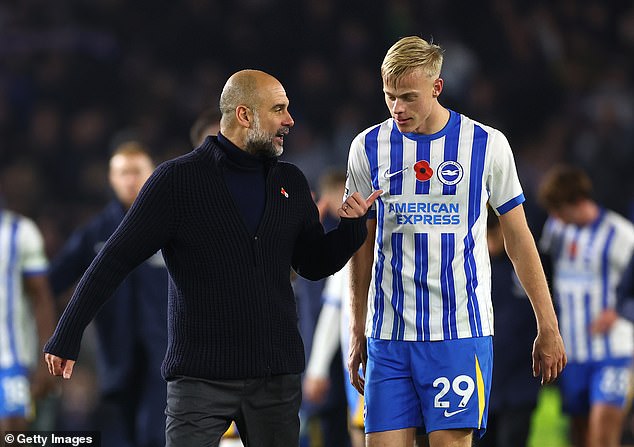 Pep Guardiola (left) was seen talking and gesturing to Jan Paul van Hecke (right) after Brighton beat Manchester City 2-1 at the AMEX Stadium on Saturday night