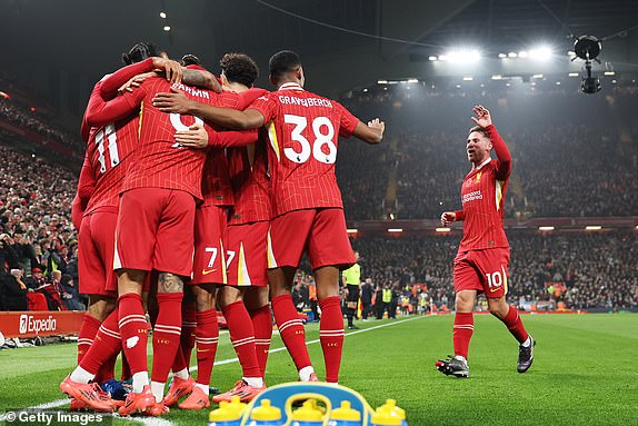 LIVERPOOL, ENGLAND - NOVEMBER 09: Alexis Mac Allister of Liverpool joins his teammates as they celebrate after Darwin Nunez scored the team's first goal during the Premier League match between Liverpool FC and Aston Villa FC at Anfield on November 09, 2024 in Liverpool, England. (Photo by Carl Recine/Getty Images)