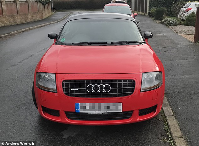 Dream car: Andrew wanted to buy a shiny red Audi TT that he had seen in the window of Stoke-on-Trent's Fast Lane Motors for his wife Louise