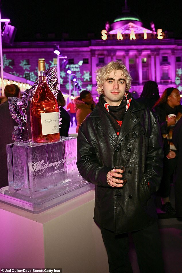 Lennon Gallagher posed with a glass of Whispering Angel at the event