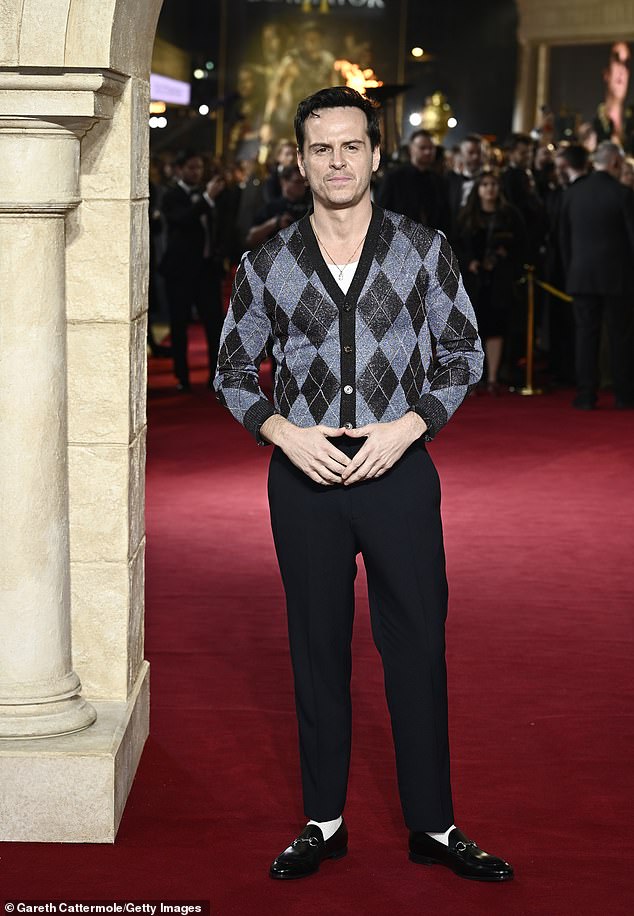 Andrew Scott wore a blue cardigan with smart trousers and Gucci loafers