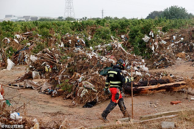 A soldier from the UME special emergency corps searches for bodies following rains and flash floods that caused rivers to burst their banks in Valencia and other parts of Spain, in the Poyo ravine in Quart de Poblet, Valencia, Spain, November 13, 2024