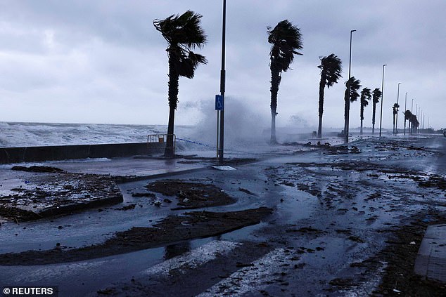 Waves hit the promenade of the Ebro Delta Nature Reserve, one of the largest wetland areas in the western Mediterranean region, in the autumnal storm system blighting Spain