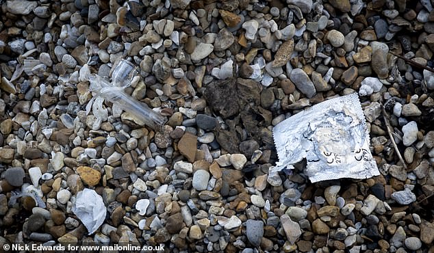 A crack pipe and a used condom packet were left in front of a disused building beside a mosque where children attend classes