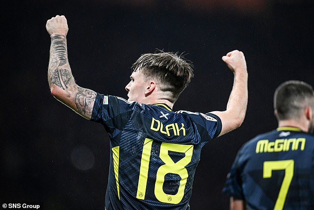 Ben Doak celebrates John McGinn's winning goal after his surging run led to the chance