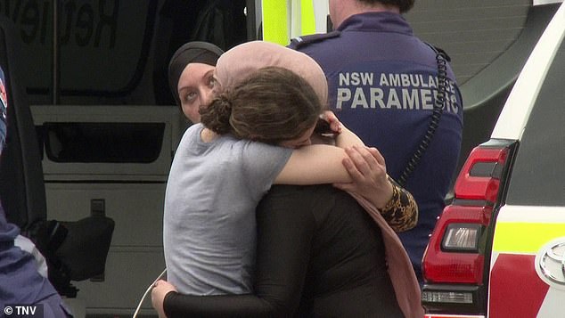 Distraught relatives consoled each other as paramedics stabalised the little boy