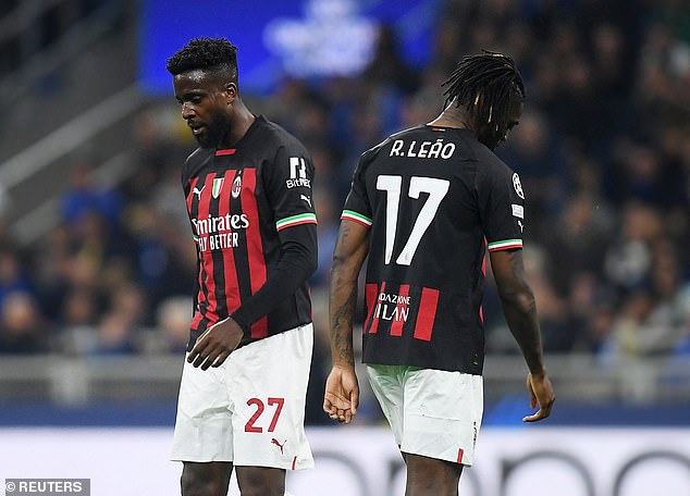 Striker Divock Origi (left) has found himself in exile at AC Milan and is training on his own