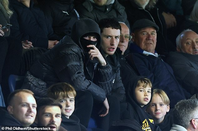 The England star was spotted at Edgeley Park in a ski mask watching Stockport beat Wrexham