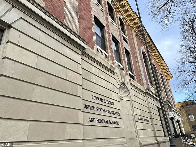 Mudslides and floods didn't allow the family-of-four's group to cross through Washington and were instead taken through Manitoba. They were supposed to be taken to Chicago after crossing the border (pictured: Minnesota courthouse)