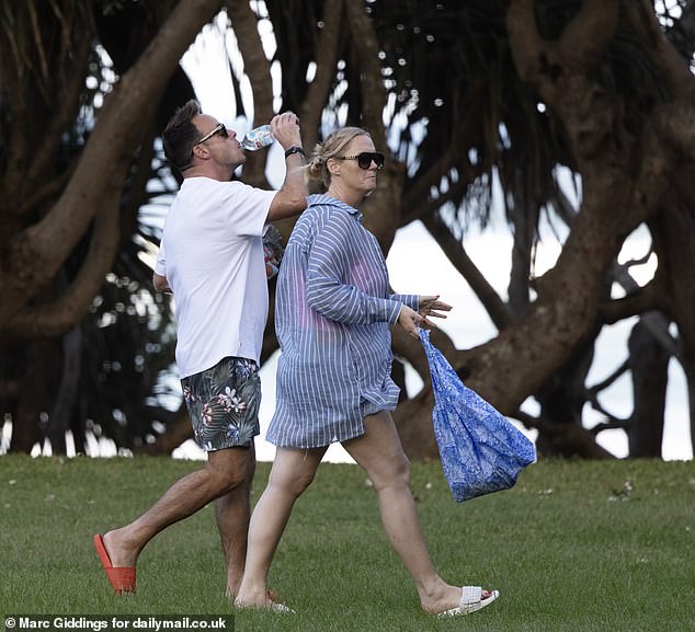 The new parents had an evening to themselves as they were pictured without their seven-month-old son, Wilder Patrick, and were seen returning from a stroll with their beach towels at 6:30pm