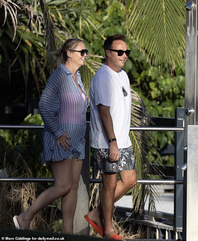 The pair were casually dressed with Ant, 49, wearing a white t-shirt and floral board shorts