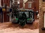 Tractor driver, 57, arrested after speeding through flooded high street was allegedly rushing to save a child and 'is deeply sorry for the damage caused', friends say