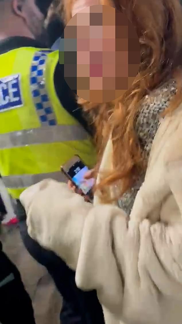 Video footage shows a young girl clashing with a police officer at Manchester Victoria